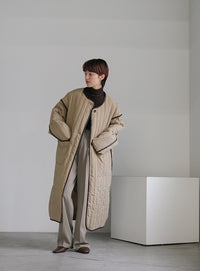 キルティングパイピングロングコート