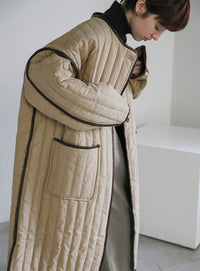 キルティングパイピングロングコート