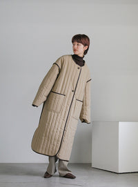 キルティングパイピングロングコート