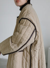 キルティングパイピングロングコート