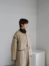 キルティングパイピングロングコート