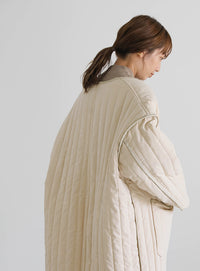 キルティングパイピングロングコート