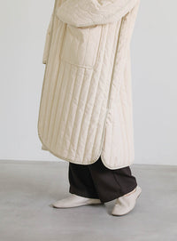 キルティングパイピングロングコート