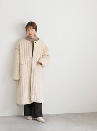 キルティングパイピングロングコート