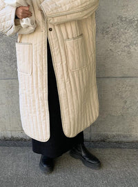 キルティングパイピングロングコート