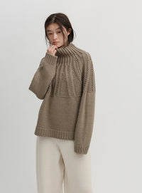 ミックスケーブルハイネックニット
