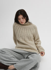 ミックスケーブルハイネックニット